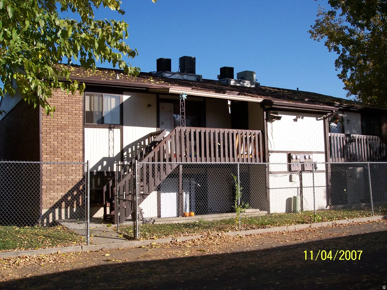 Two-story structure featuring brick and siding exterior