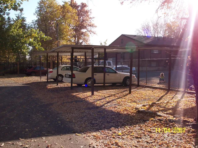 Carport structure with a metal roof and support pillars