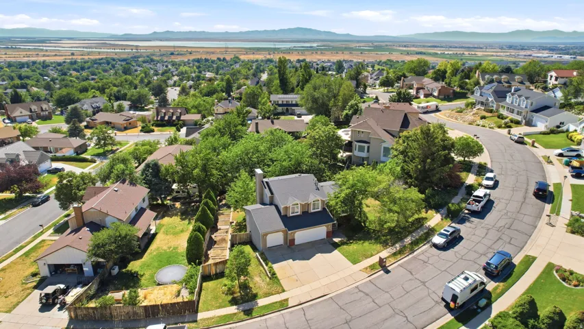 Two-story residence with a two-car garage, featuring a driveway and front yard landscaping