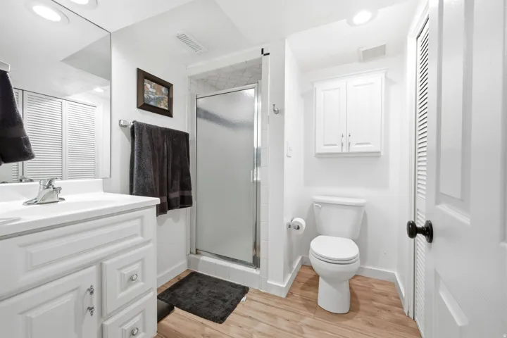 White vanity with integrated sink and chrome faucet