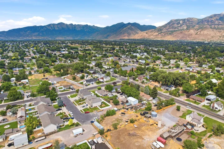 Expansive residential neighborhood with mature trees and a distant mountain backdrop