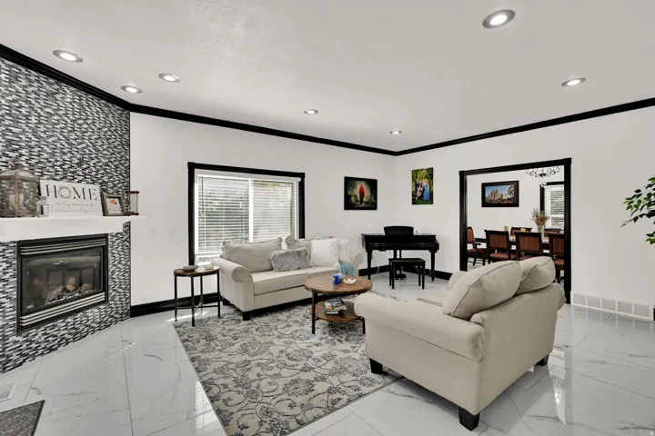 Spacious interior featuring white walls, black trim, and recessed lighting