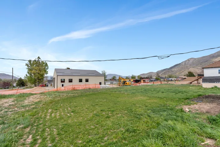 Expansive land parcel with surrounding mountain scenery