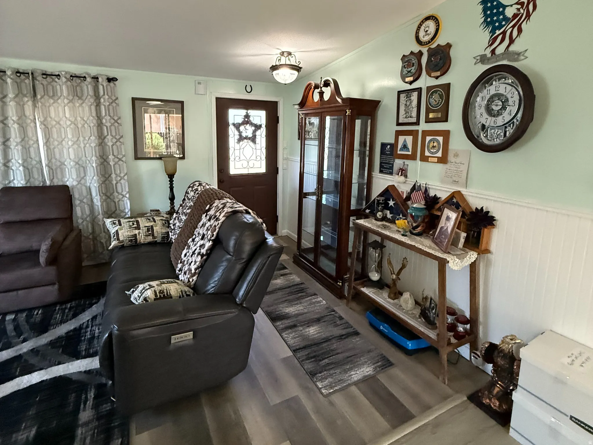 Light wood-finish flooring extends throughout this space