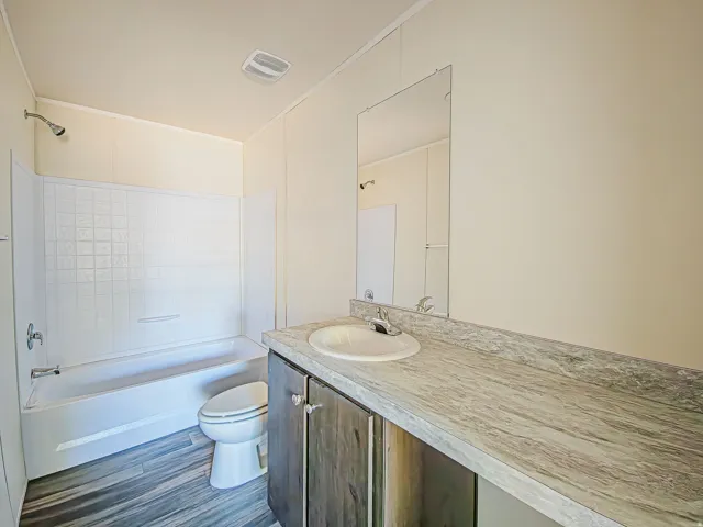 Tub and shower combination with a textured surround