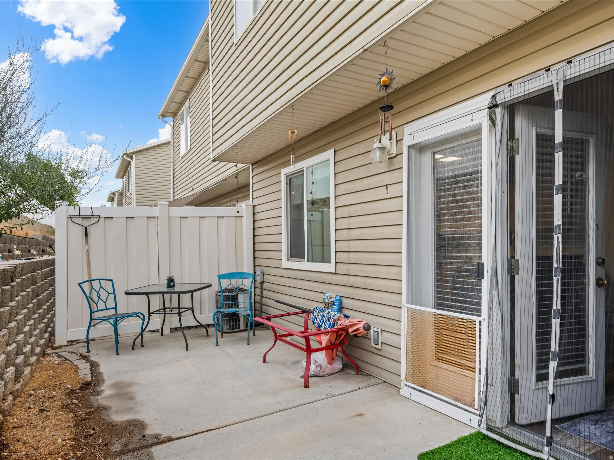 private back patio with privacy wall