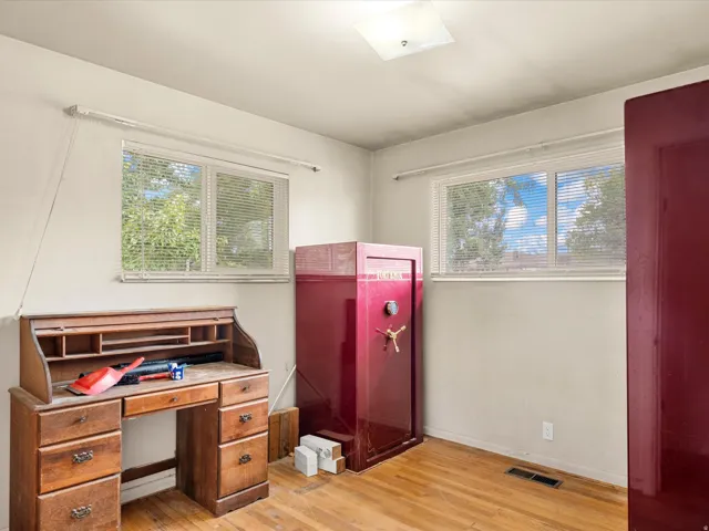 Light-filled interior space with wood-finish flooring