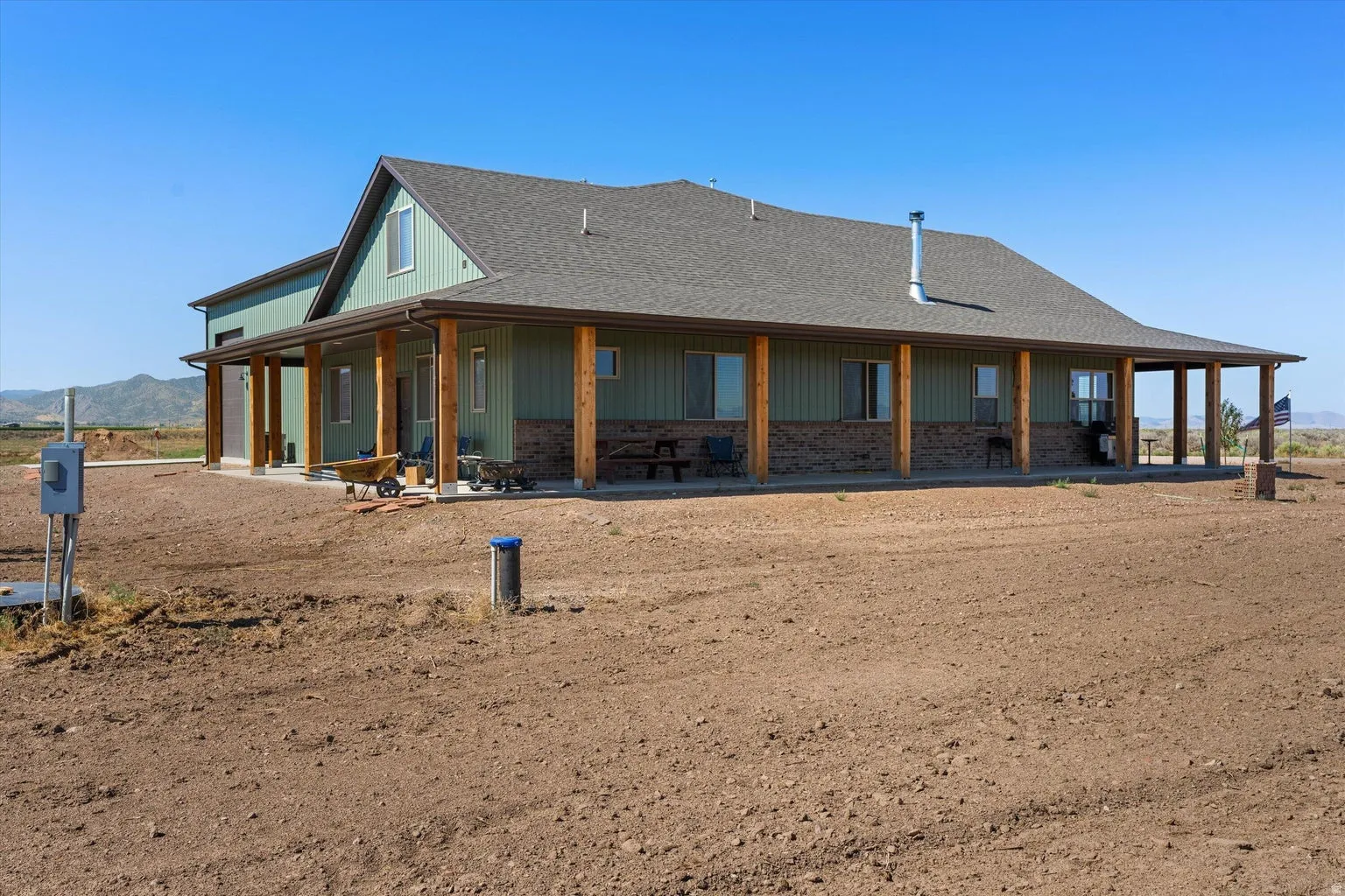 Ranch-style residence featuring a prominent covered porch extending across the front and side