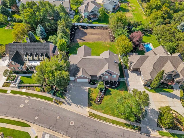 Brick exterior residence with a multi-gabled roofline and an attached garage
