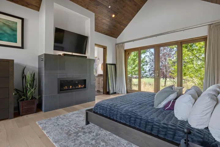 Vaulted wood-finish ceiling over engineered wood flooring