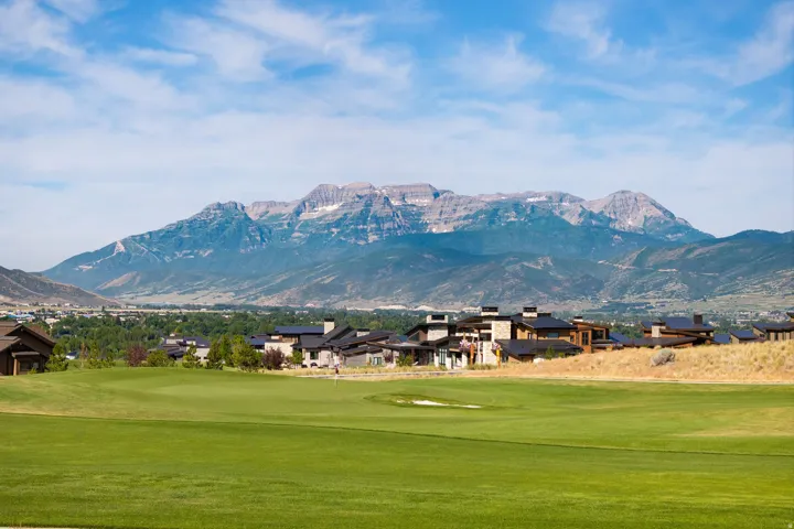 Expansive golf course frontage with mountain backdrop