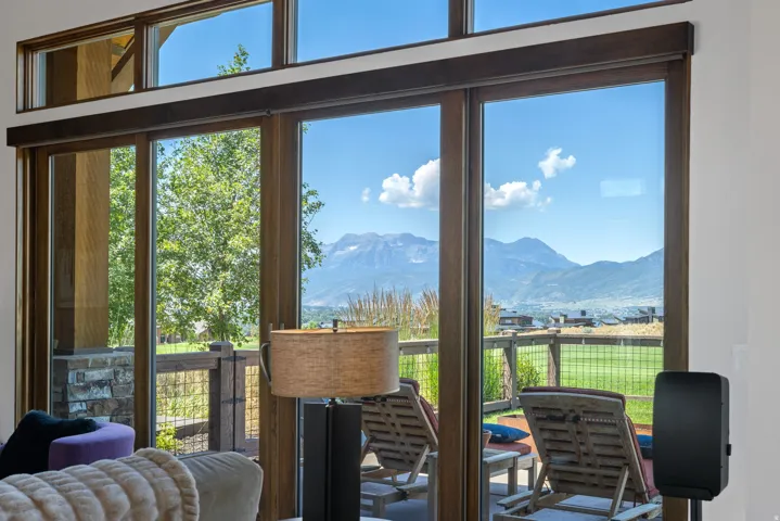 Expansive glass sliding doors with transom windows