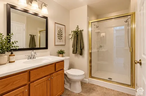 Single vanity with wood-finish cabinetry, a white countertop, and an undermount sink
