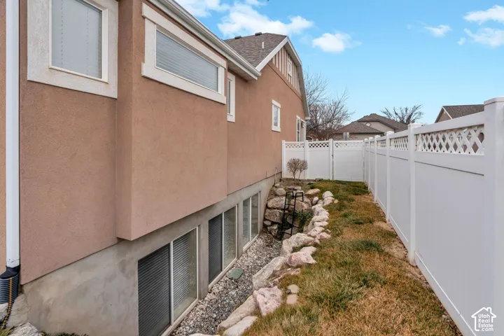 Exterior stucco finish with decorative trim around upper windows