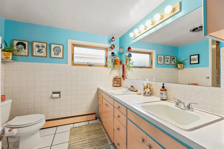 Dual vanity with integrated sinks and ample storage cabinetry