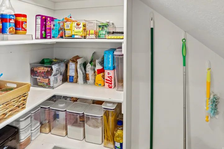 Built-in pantry shelving provides extensive storage capacity