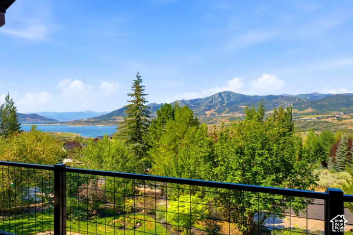Expansive outdoor space featuring a black metal grid railing