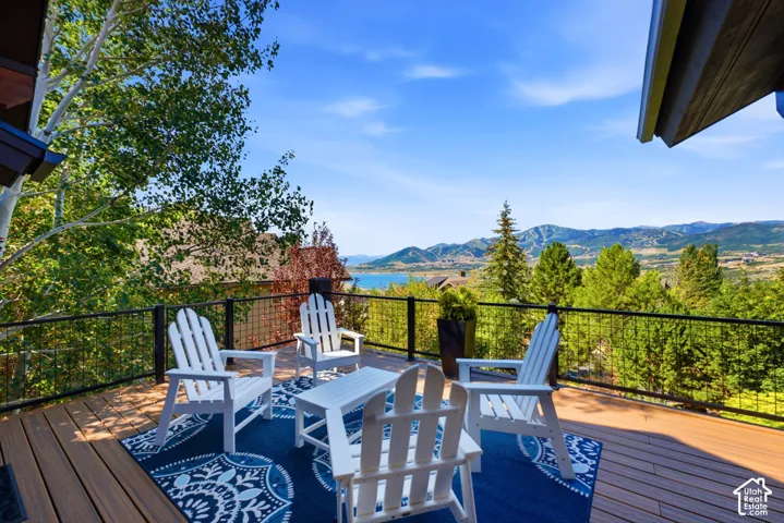 Expansive wood-finish deck with black metal railings