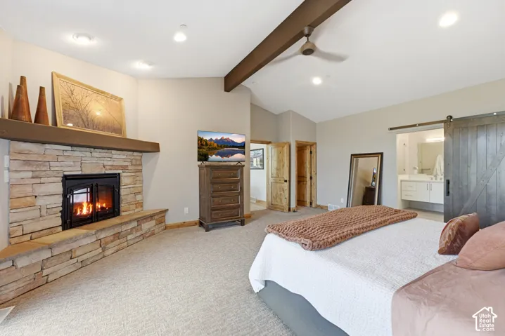Stone-clad fireplace with a wood mantel