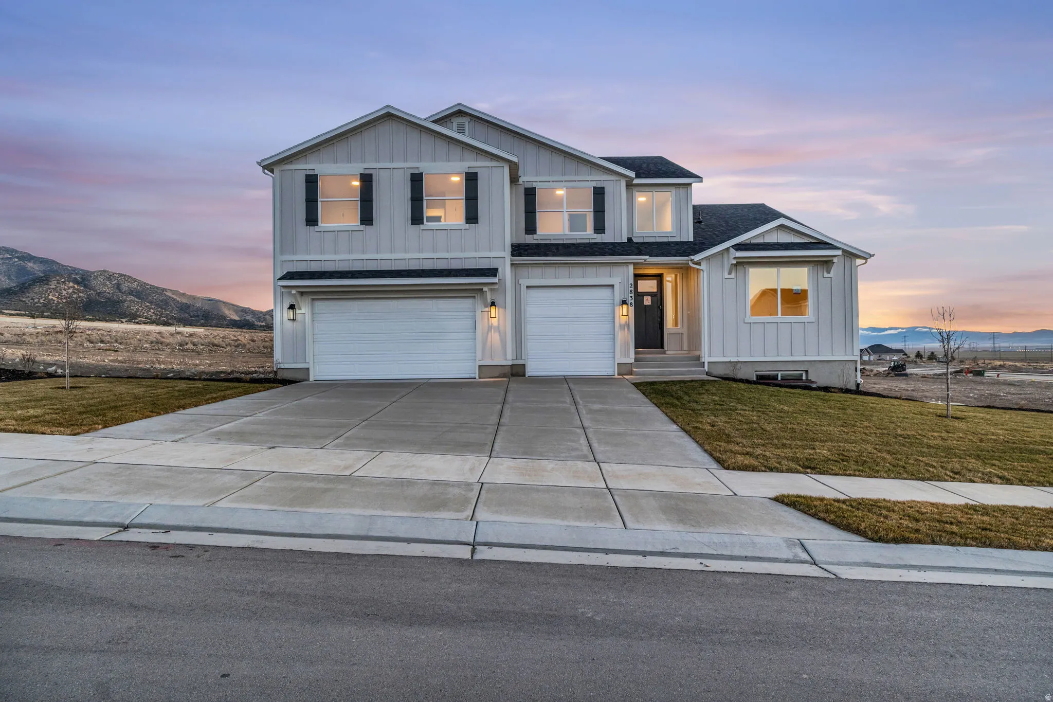 Front view of farmhouse style large estate home with more than 5,500 square feet.