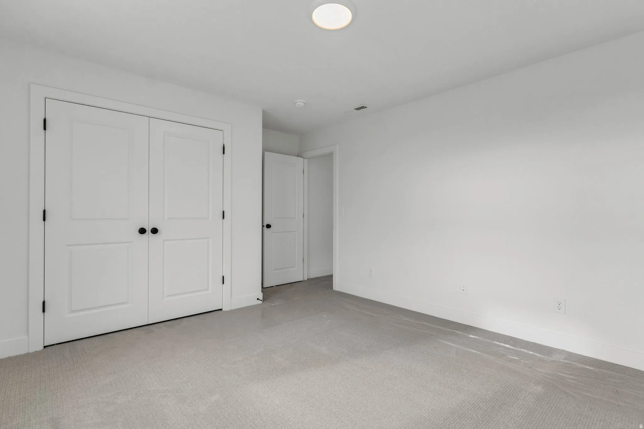Guest suite view of large two door closet.