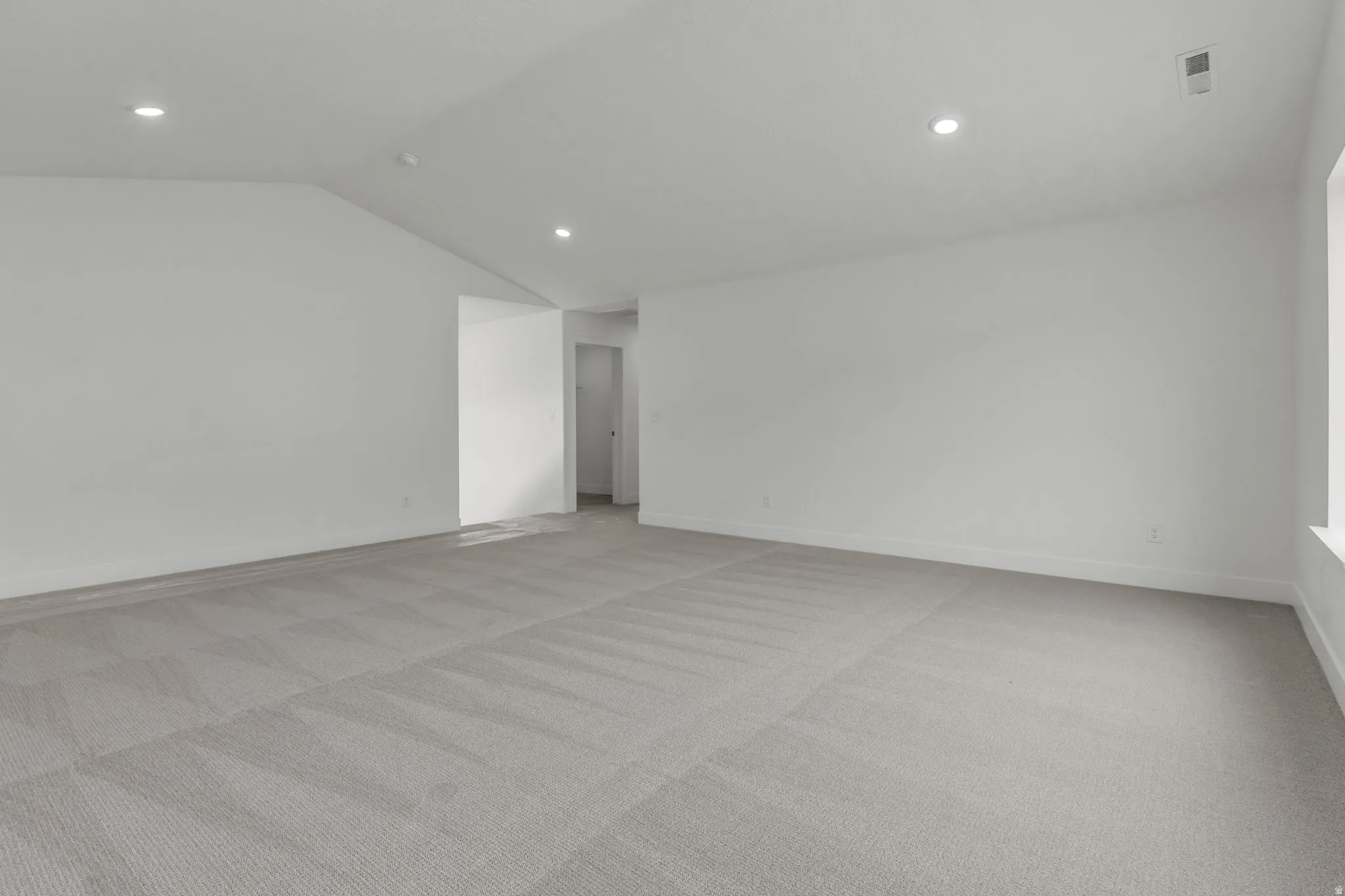 Huge loft with vaulted ceiling and tons of natural light.