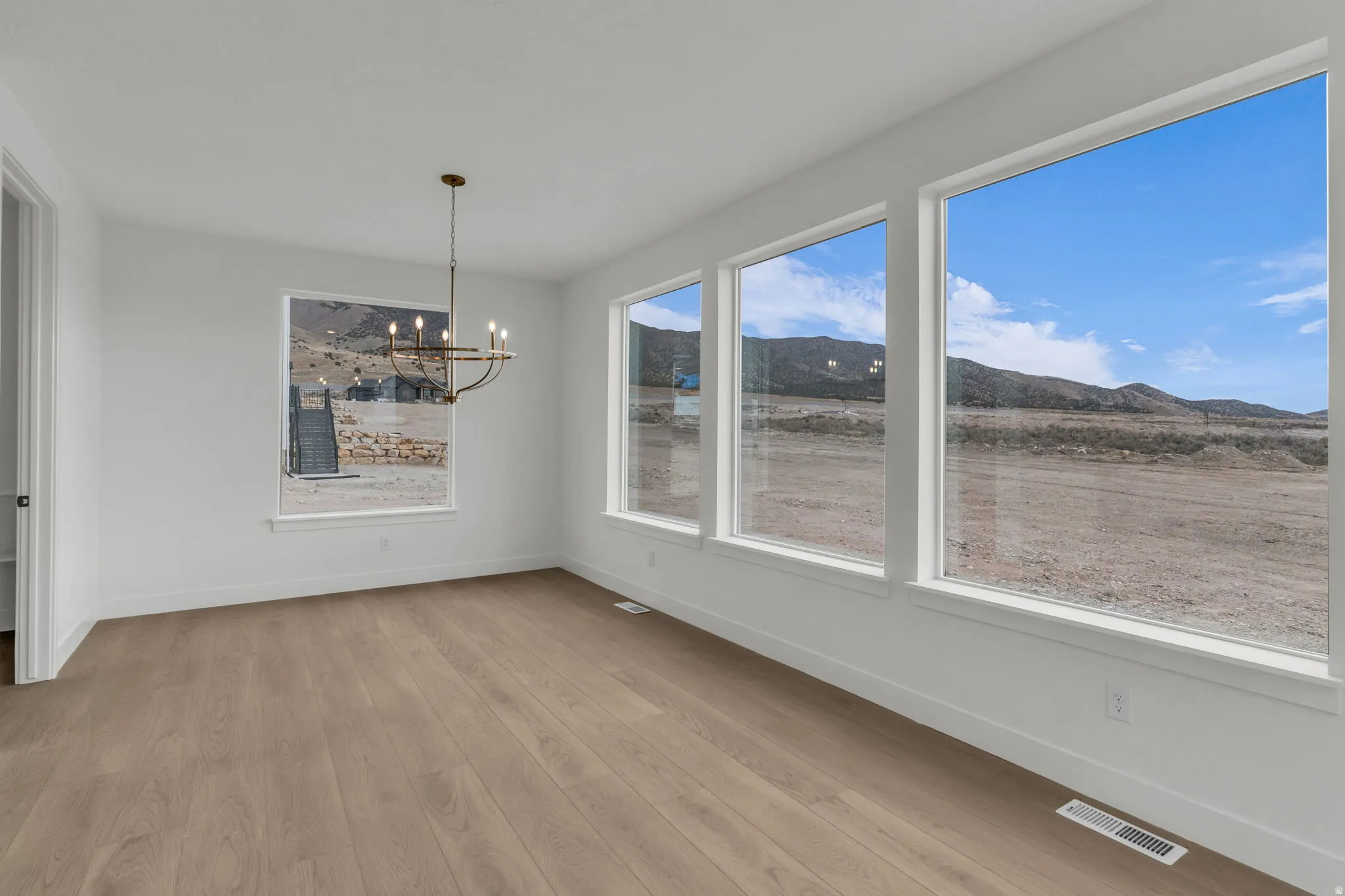 Spacious dining with spectacular views with custom oversized picture windows.
