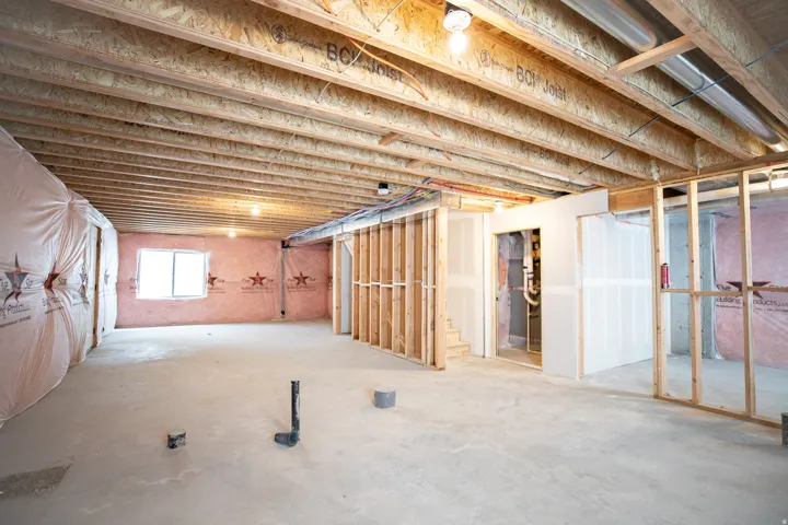 Unfinished basement with potential for large family/game room with full bathroom.