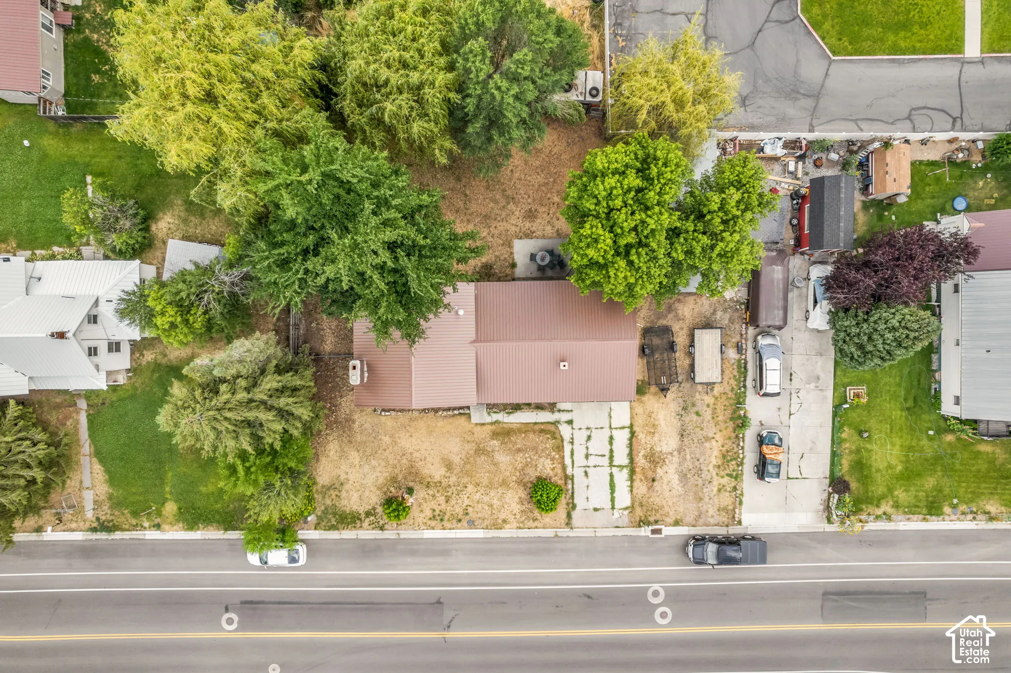 Property featuring mature trees and established landscaping