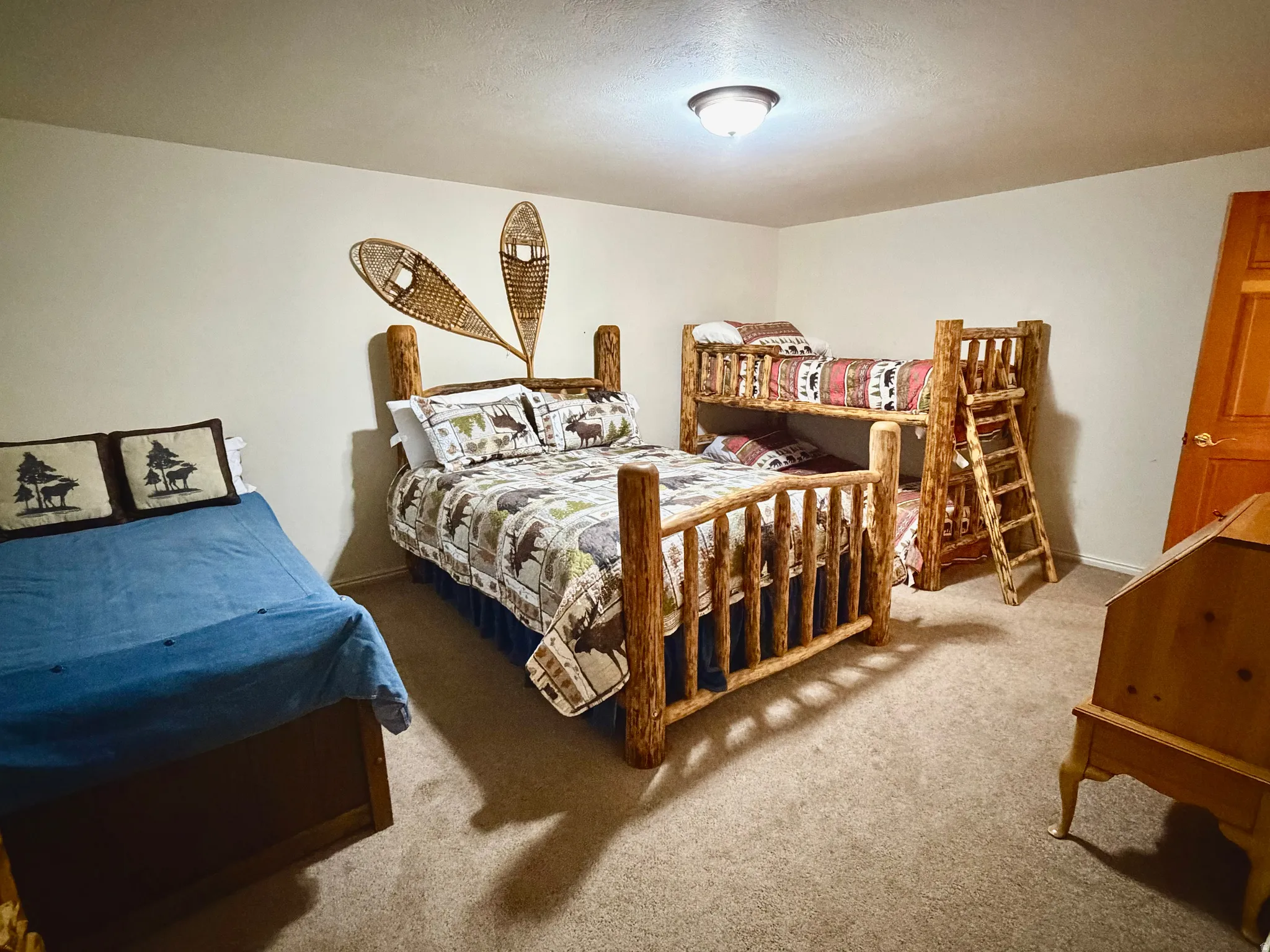 Bedroom featuring carpet flooring and a flush-mount ceiling light