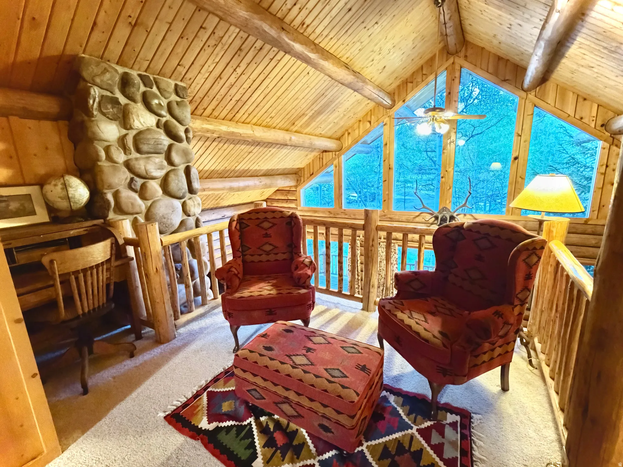 Vaulted wood-paneled ceilings with exposed log beams