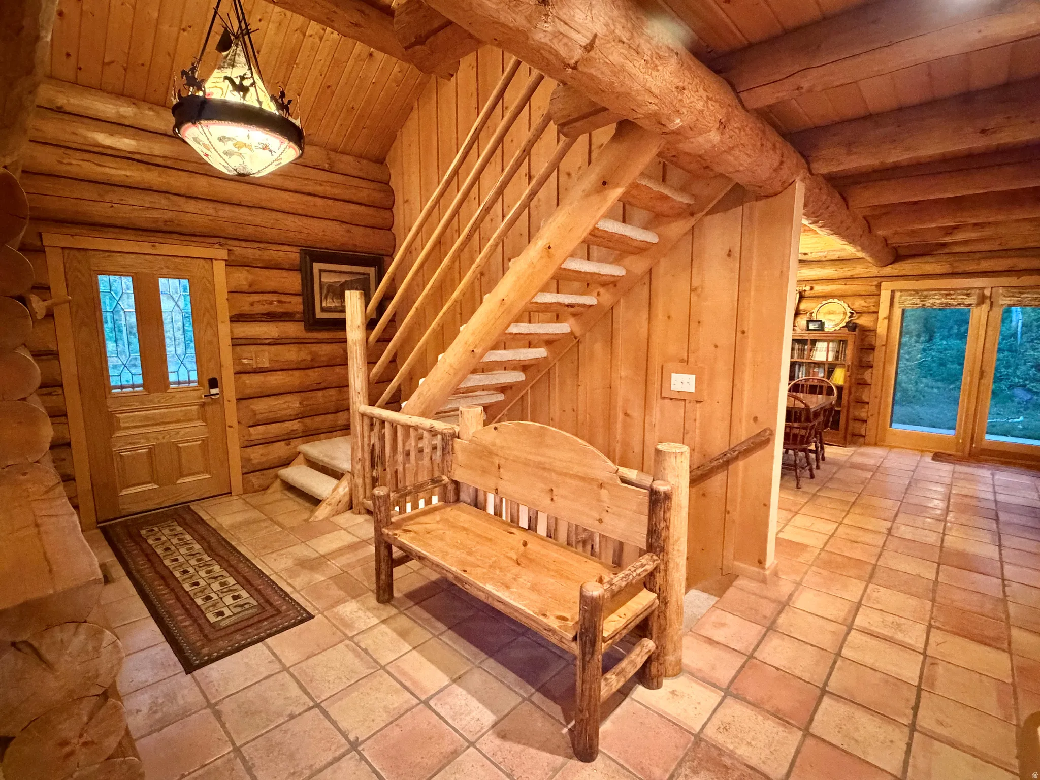 Log cabin interior featuring exposed wood beams and walls
