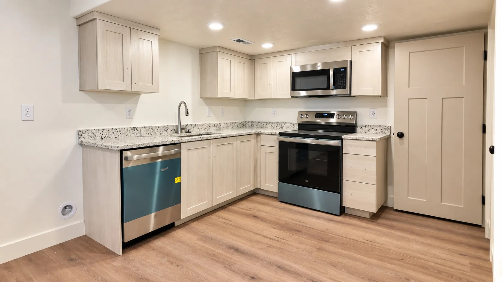 Contemporary kitchen featuring light wood-finish cabinetry, granite-style countertops, stainless steel appliances, a stainless steel sink with a high-arch faucet, and wood-finish flooring