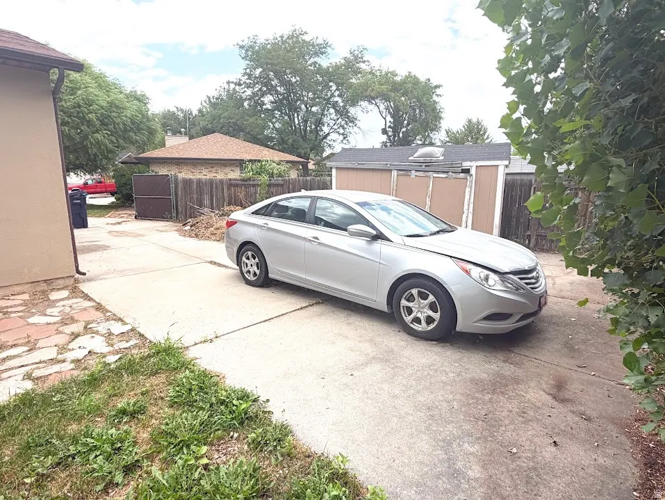 Concrete driveway with flagstone patio extension