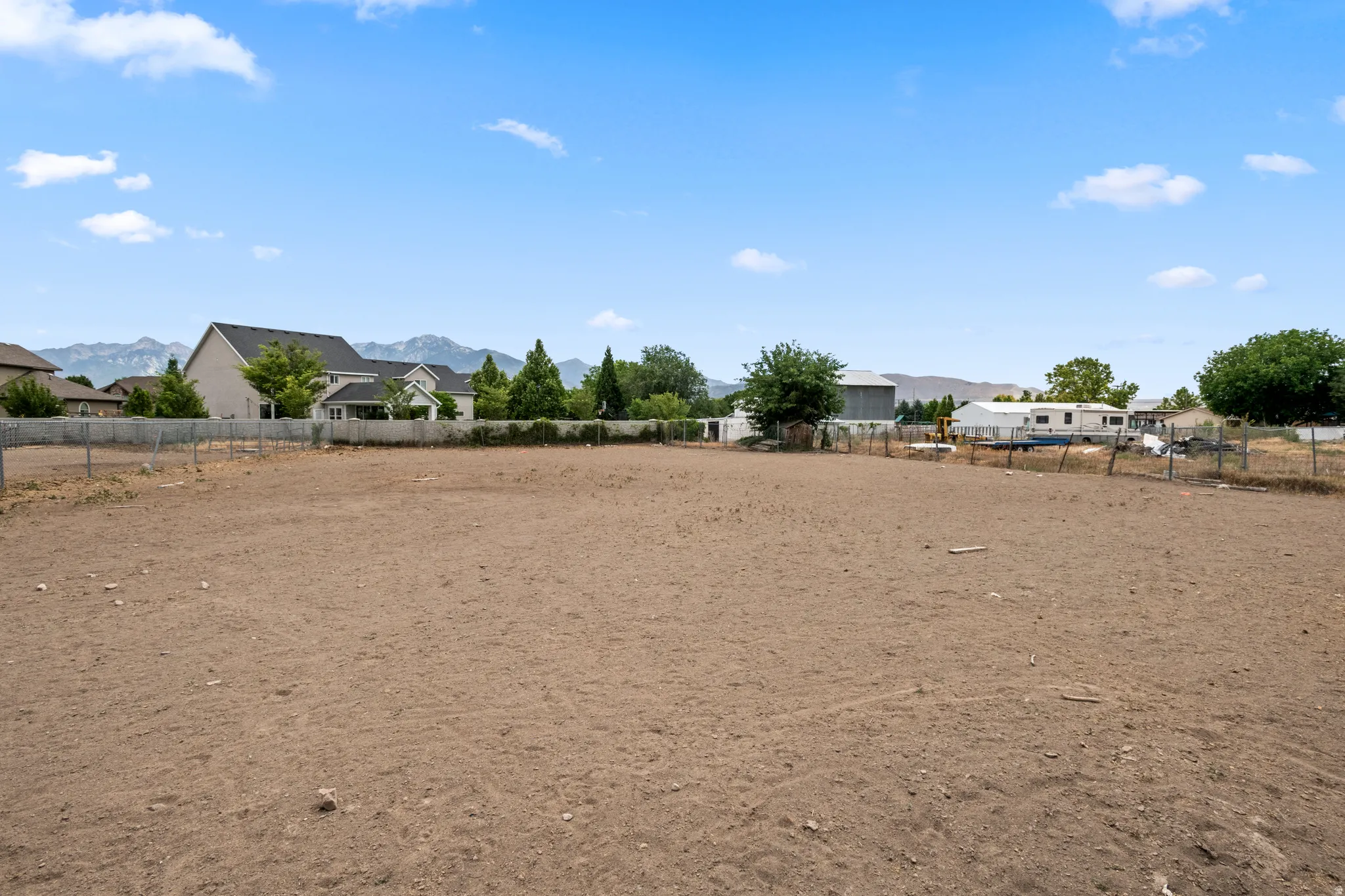 Expansive lot with perimeter fencing