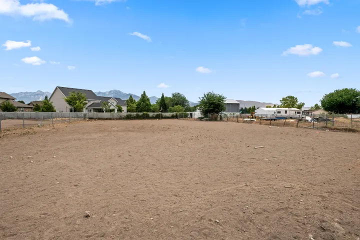 Expansive lot with perimeter fencing