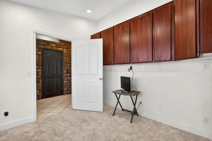 Plush carpeted flooring and white walls