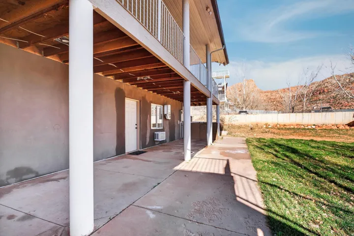 Ground-level patio with concrete flooring