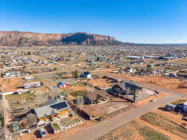Aerial perspective showcasing a residential community with a prominent mountain backdrop