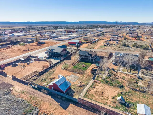 Aerial perspective showcasing a residential and commercial area with distant mountains