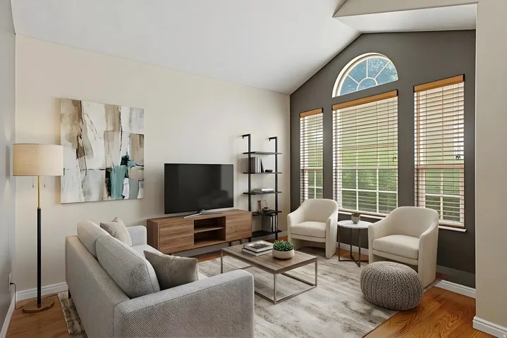 Virtually stage Living area featuring vaulted ceilings, a large arched window, and two additional tall windows with blinds