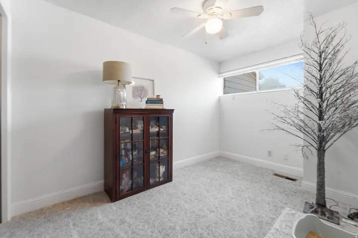 White-painted interior with crown molding and light-colored carpeting