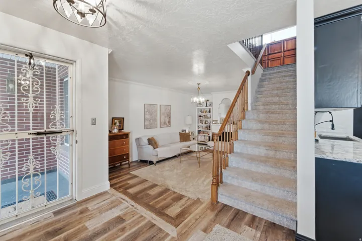 Entryway featuring wood-finish flooring and a security screen door