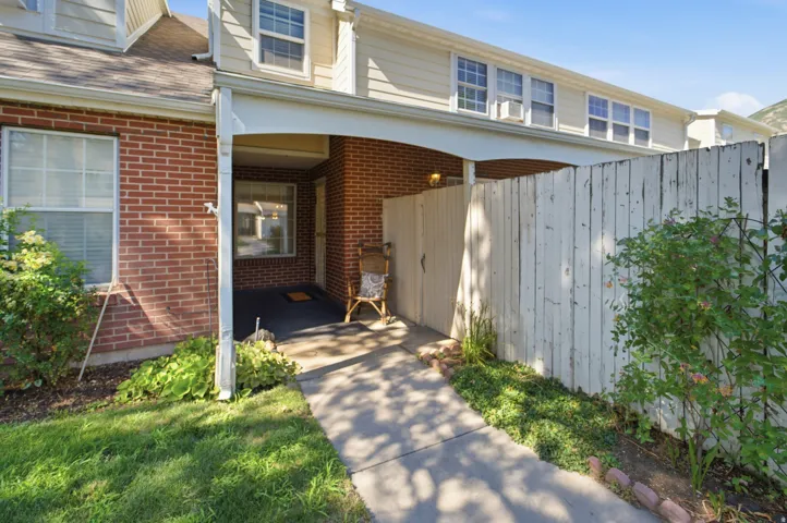 Brick and siding exterior with a covered entry