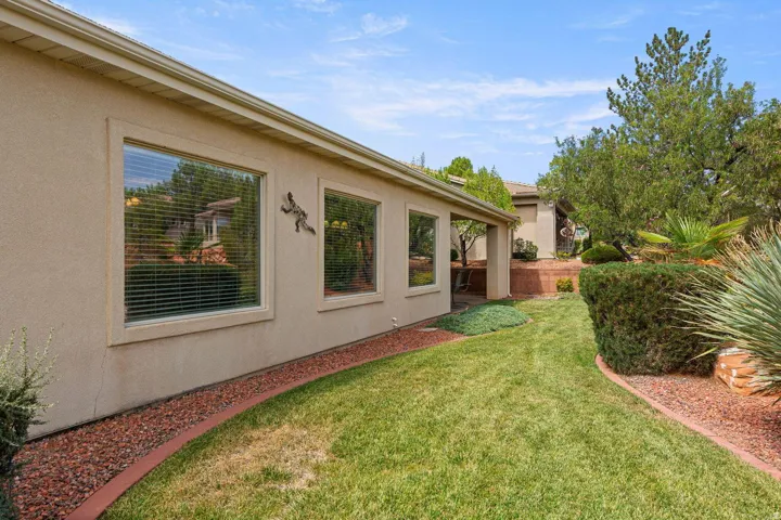 Manicured lawn with decorative rock landscaping borders
