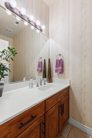 Bathroom vanity with a white countertop and an undermount sink
