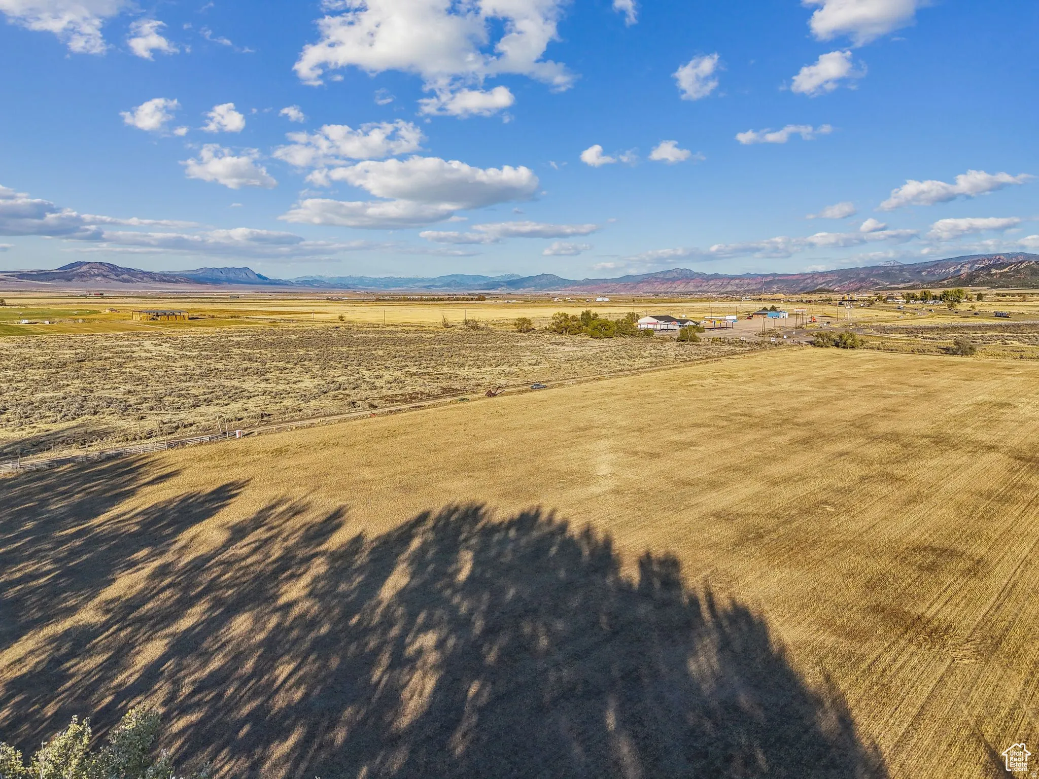 Expansive open fields with distant mountain backdrop