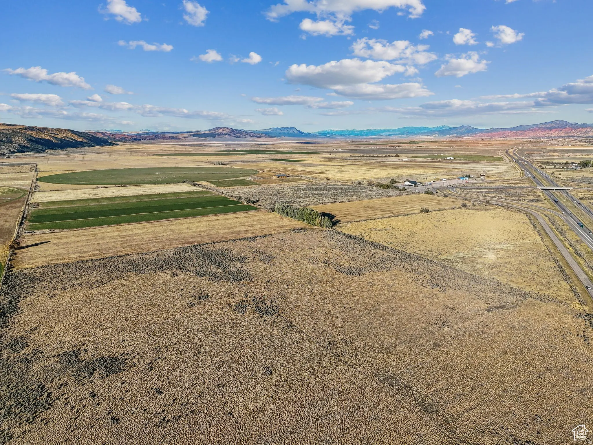 Expansive agricultural landscape featuring cultivated fields and vast open terrain