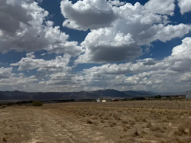 Expansive undeveloped land with a distant mountain backdrop