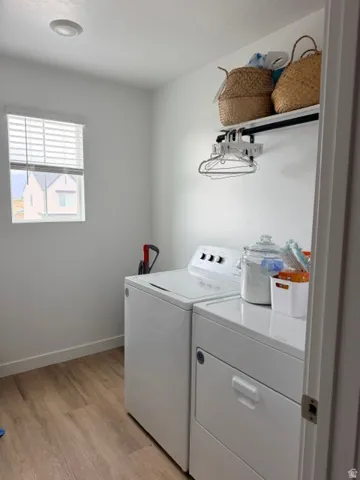 Bright utility space with wood-finish flooring